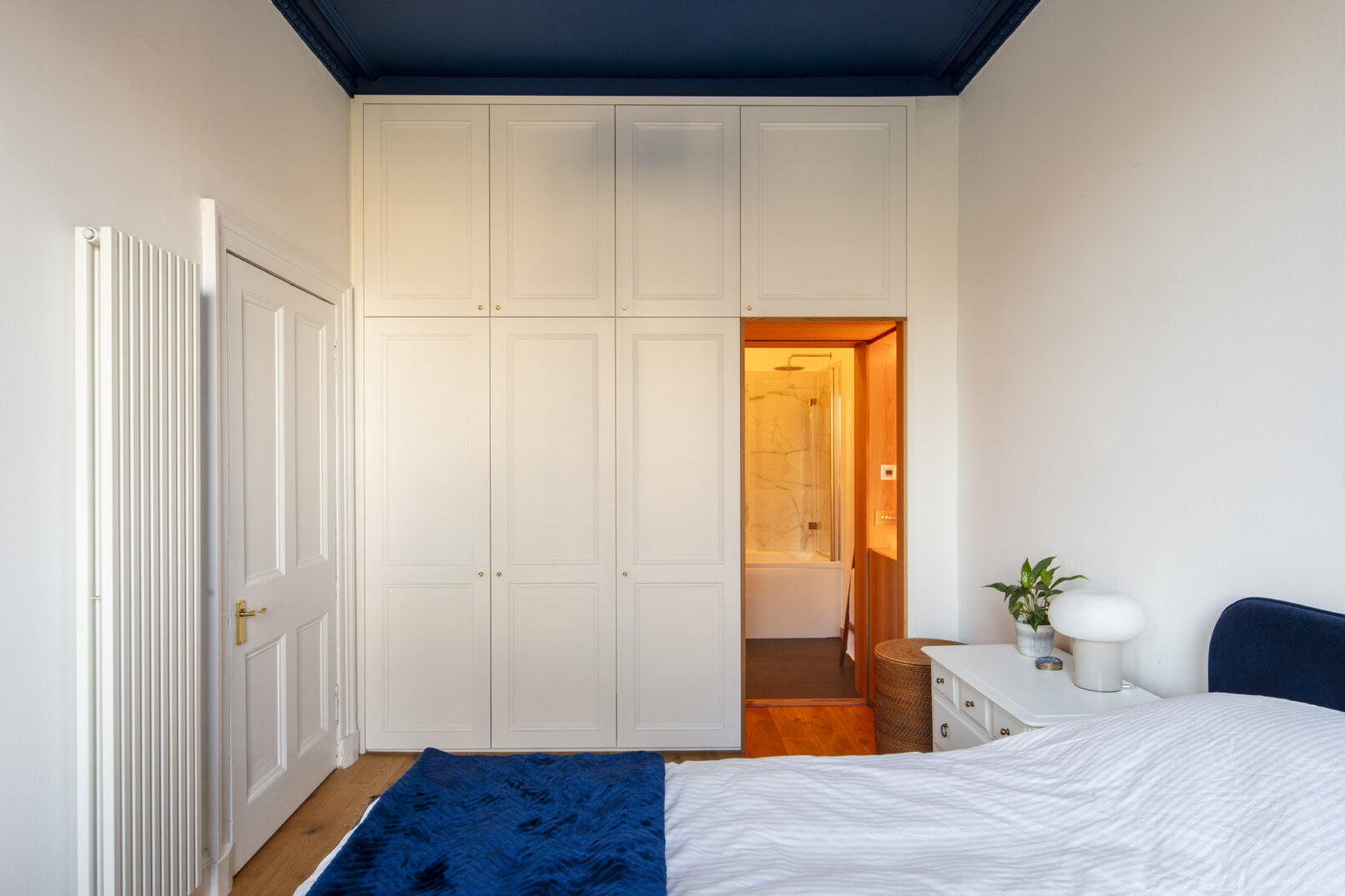 Alteration of a New Town Edinburgh apartment. A new contemporary kitchen is open plan to living room. Calum Duncan Architects Edinburgh. Energy improvements using low carbon low toxicity natural materials. Ensuite cabinetry by Broadworkshop.